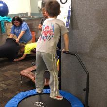 child on trampoline